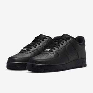 Nike Black Sneakers with Thick White Sole and Low-Top Design